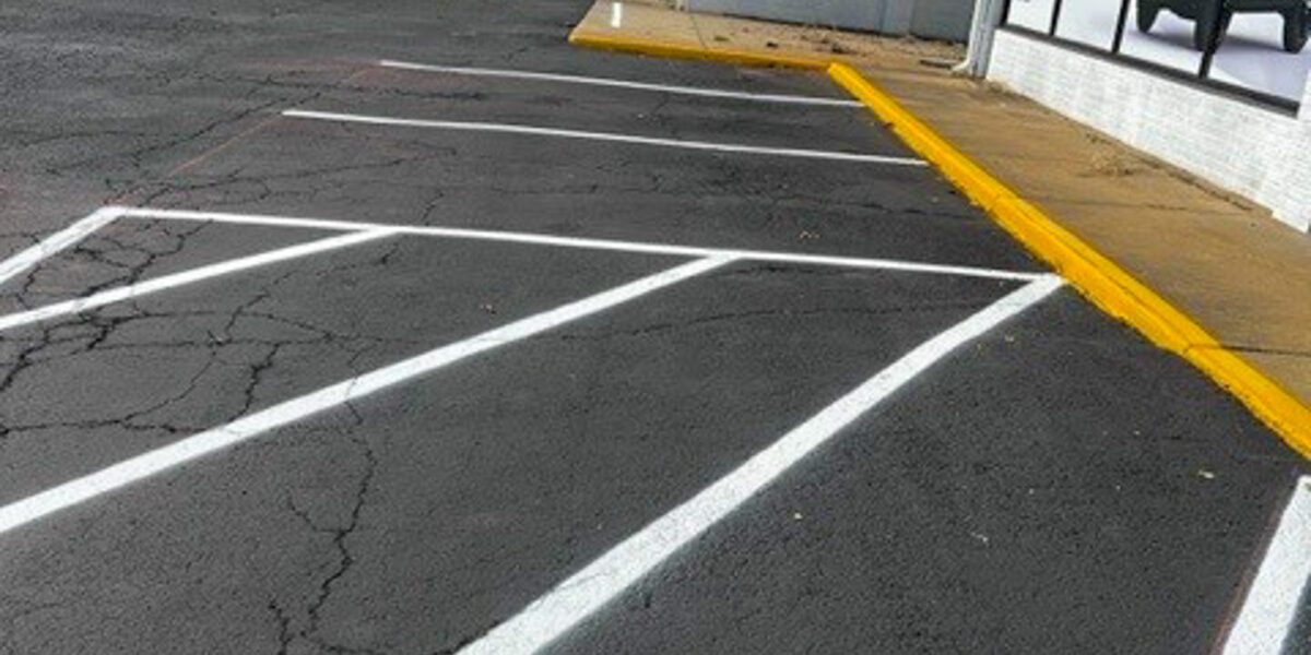 Asphalt parking lot marking and striping by Mad Jack's