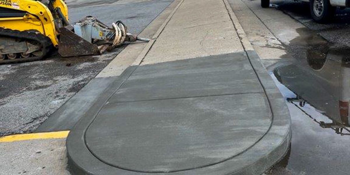 Freshly poured concrete divider poured by Mad Jack's Asphalt & Concrete, LLC