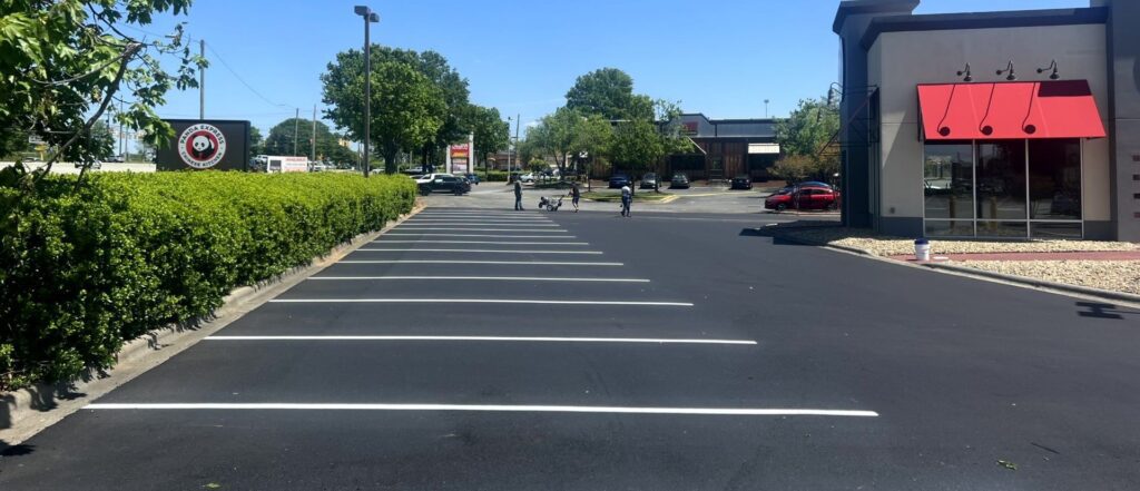 A properly maintenance parking lot that has been sealcoated and striped as part of it's preventative and maintenance program.