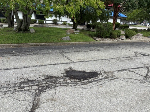 Asphalt pothole filling by Mad Jack's Asphalt & Concrete